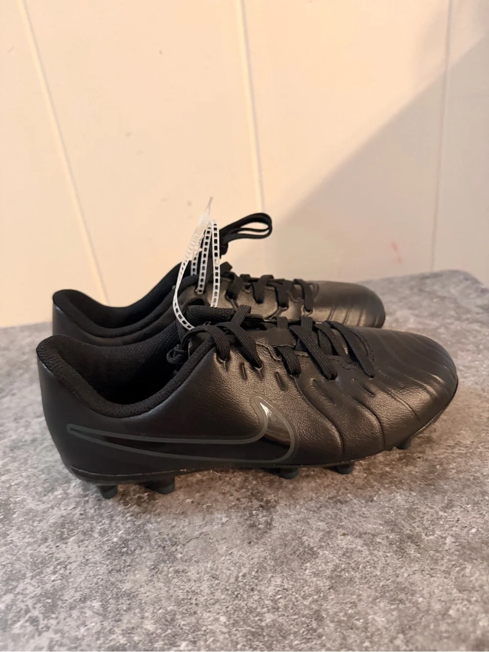Nike Kids Black Soccer Cleats with Subtle Dark Swoosh